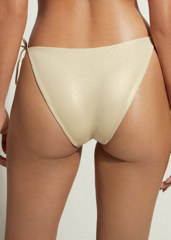 zlati ženski bikini spodnji del calzedonia z zavezovanjem abu dhabi